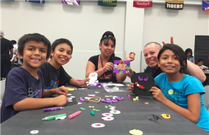 Families get creative at pumpkin night. 